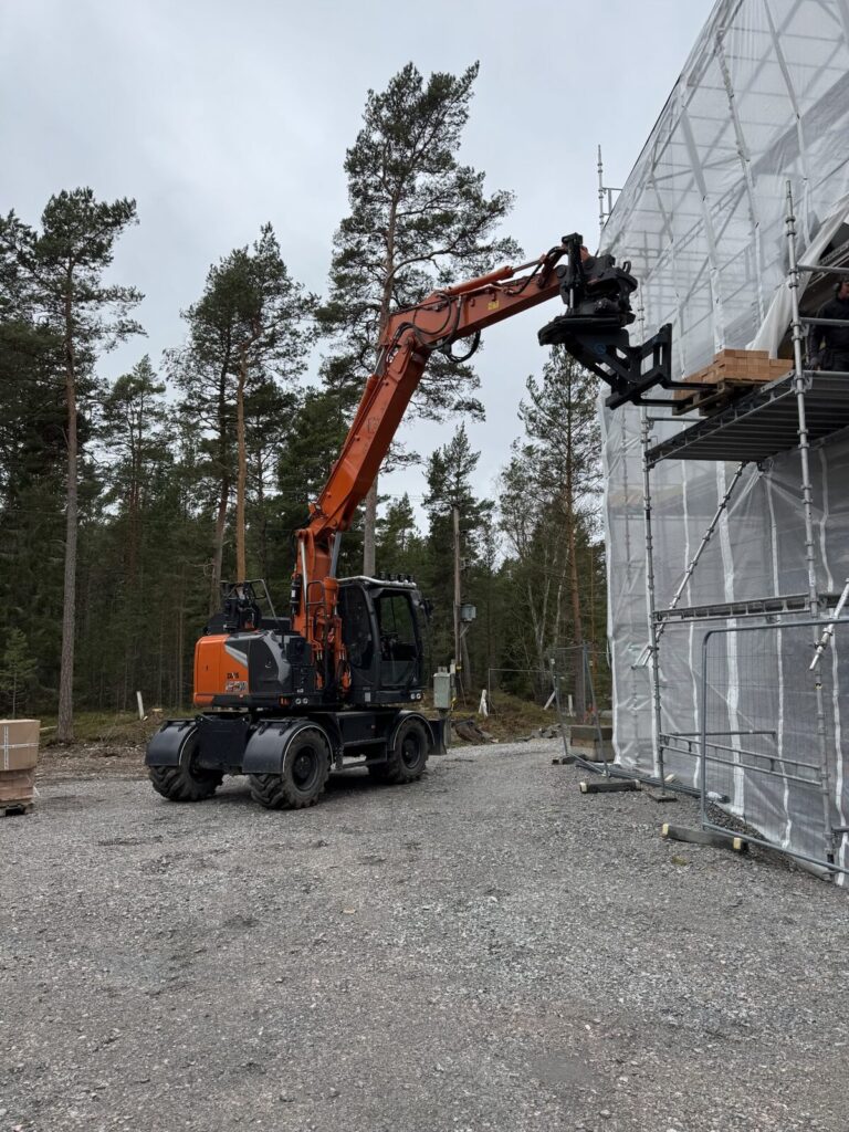 Grävox hjulgrävare på byggarbetsplats
